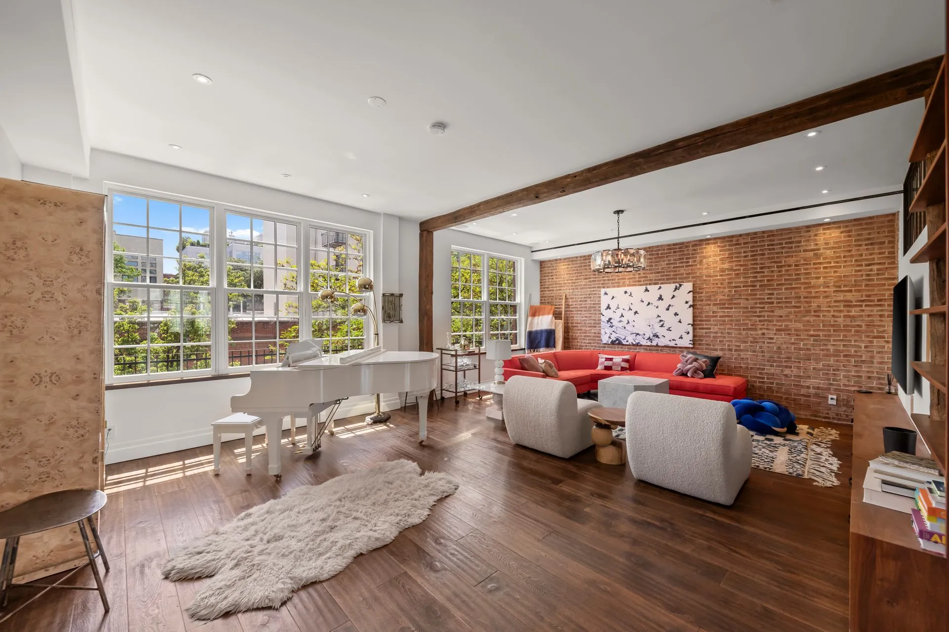 A large swimming pool with a hot tub next to it.